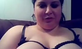 Fat Arab battle-axe shows off her tits on webcam