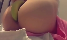 Bubble booty femboy playing with a banana
