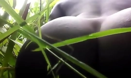 native African dildo masturbating in the jungle