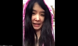 Chinese Teen stars in Bollywood Spectacular and then flashes big breasts outdoors in the rain