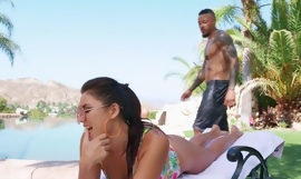Young brunette pleasuring handsome black guy by the pool